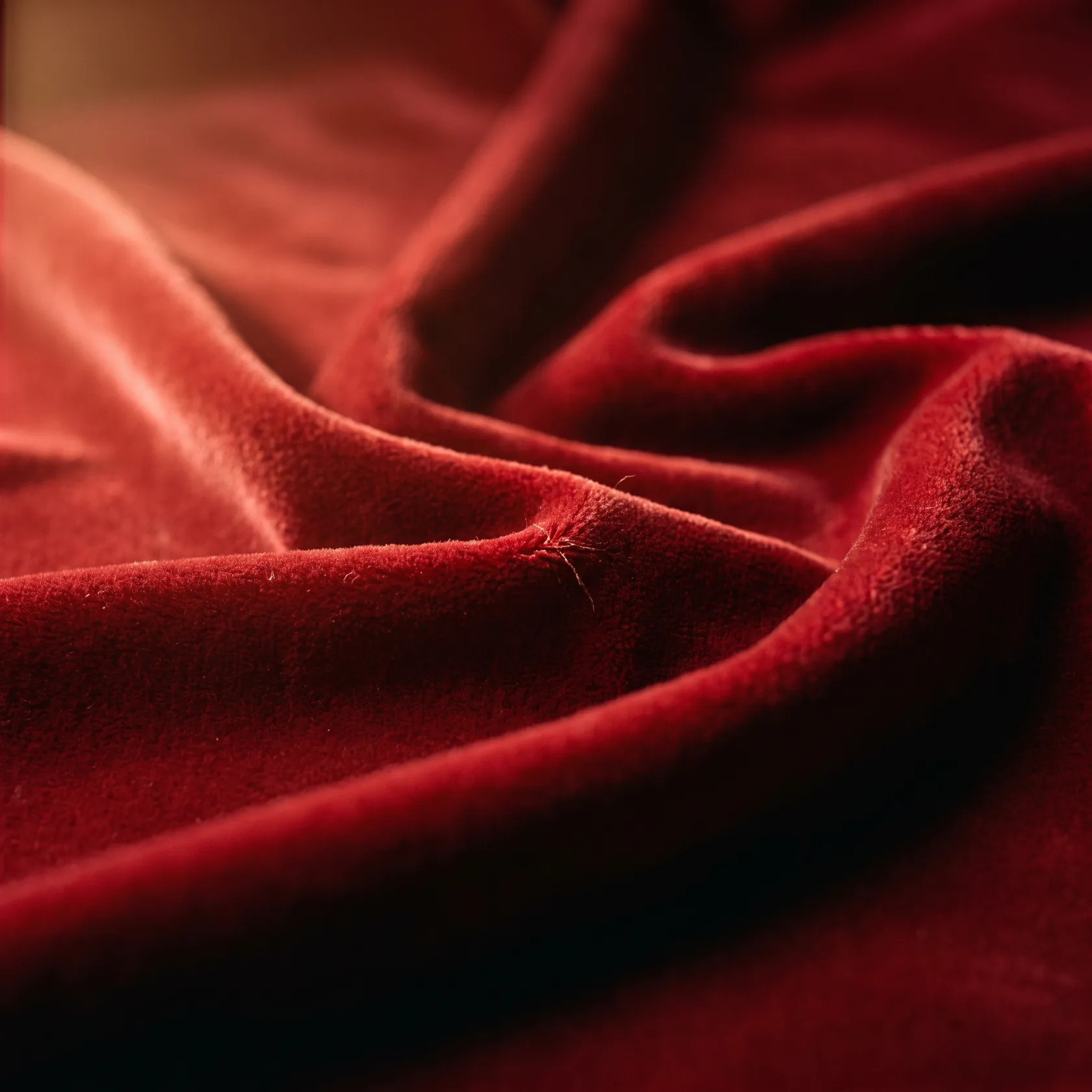 Deep crimson velvet upholstery fabric texture